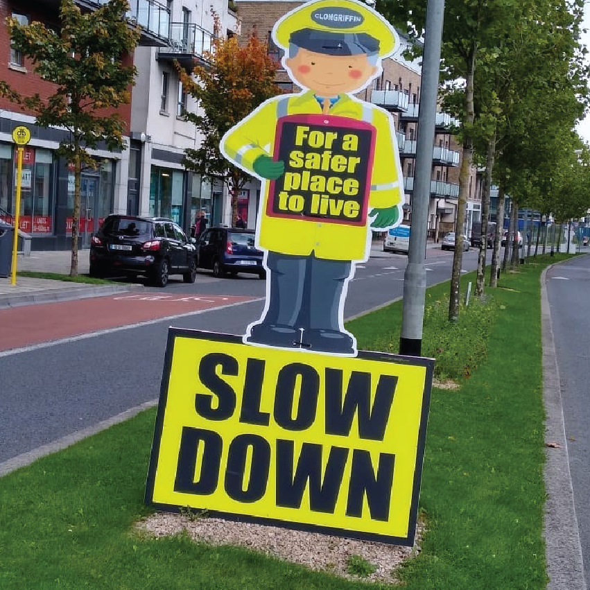 Example of a bespoke road safety sign made by www.signsonline.ie. This one says "for a safer place to live" and "SLOW DOWN"