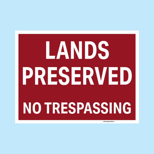 A rectangular red warning sign with a white border and bold white text reading 'LANDS PRESERVED NO TRESPASSING' on a light blue background.